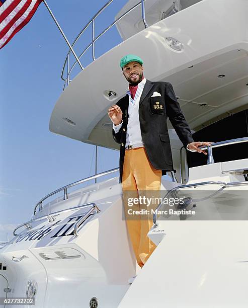 Photographed aboard the Maverick III in Marina del Rey, California. Jacket, shirt, pants, ascot and belt by Ralph Lauren, pocket square Dominico...