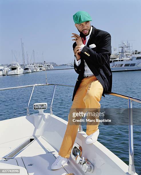 Photographed aboard the Maverick III in Marina del Rey, California. Jacket, shirt, pants, ascot and belt by Ralph Lauren, pocket square Dominico...