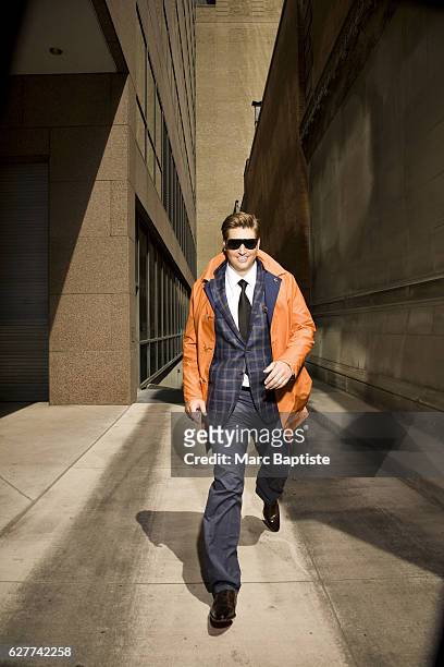 April Francis, Grooming: Sara Salatanovitz. Overcoat by Kiton, sport coat by Oxxford, shirt by Zegna, tie by Charvet, pants by Kiton, sunglasses by...