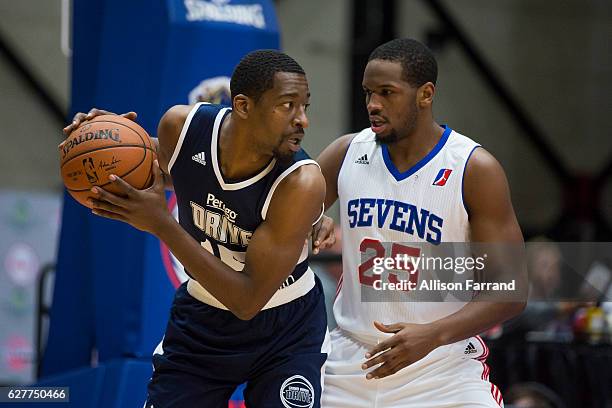 Jordan Crawford of the Grand Rapids Drive is guarded by Dionte Christmas of the Delaware 87ers at the DeltaPlex Arena on December 4, 2016 in Walker,...