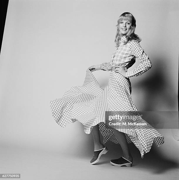 Sally Bodington models a gingham hoedown skirt, UK, 20th April 1971.