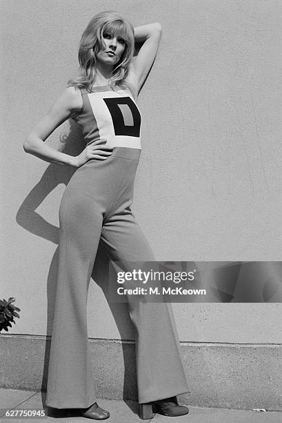 English fashion model Paulene Stone wearing a 'City' trouser suit, UK, 28th April 1971.