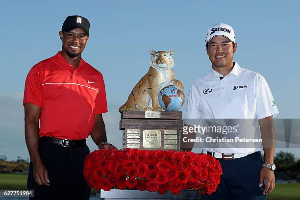 Hideki Matsuyama of Japan poses with the trophy and host Tiger Woods after winning the Hero World Challenge at Albany, The Bahamas on December 4,...