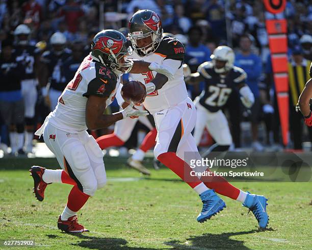 Tampa Bay Buccaneers Quarterback Jameis Winston hands off the ball to Tampa Bay Buccaneers Running Back Doug Martin during the NFL football game...