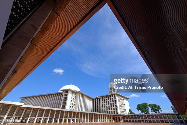 istiqlal mosque in fame with dramatic sky in jakarta. jakarta landmark. jakarta, indonesia. - istiqlal stock pictures, royalty-free photos & images