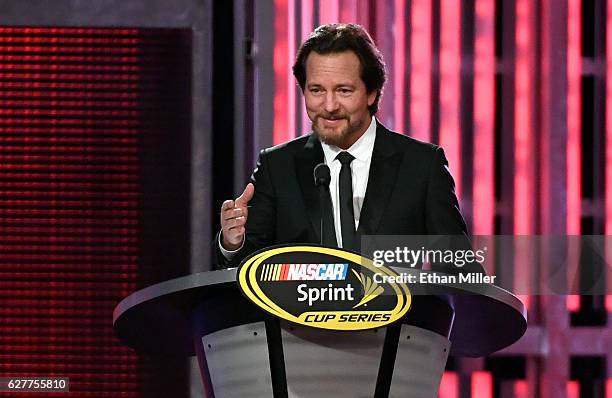 Singer/guitarist Eddie Vedder of Pearl Jam introduces NASCAR Sprint Cup Series driver Tony Stewart during the 2016 NASCAR Sprint Cup Series Awards...