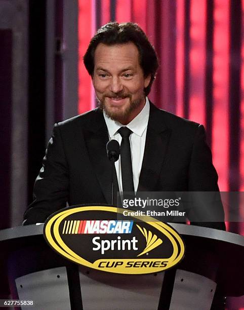 Singer/guitarist Eddie Vedder of Pearl Jam introduces NASCAR Sprint Cup Series driver Tony Stewart during the 2016 NASCAR Sprint Cup Series Awards...