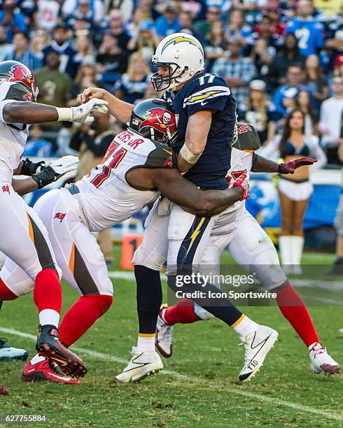 Tampa Bay Buccaneers Defensive End Robert Ayers hits San Diego Chargers Quarterback Philip Rivers during the NFL football game between the Tampa Bay...