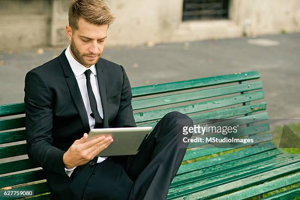 businessman using digital tablet. - suit waistcoat stock pictures, royalty-free photos & images