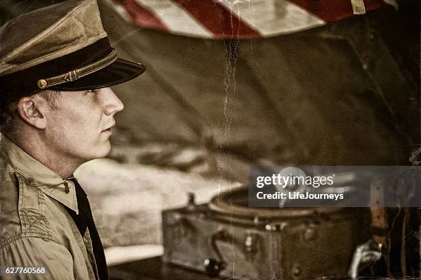 naval officer and old phonograph in a tent on site - allied forces stock pictures, royalty-free photos & images