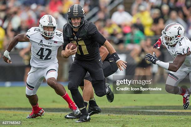 Purdue University quarterback David Blough scrambles during the NCAA football game between the Purdue Boilermakers and Cincinnati Bearcats at...