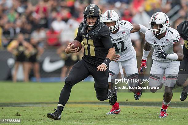 Purdue University quarterback David Blough scrambles during the NCAA football game between the Purdue Boilermakers and Cincinnati Bearcats at...