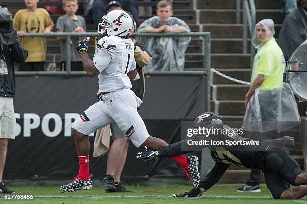 Cincinnati Bearcats wide receiver Kahlil Lewis gets tripped up just short of the end zone by Purdue University safety Navon Mosley during the NCAA...