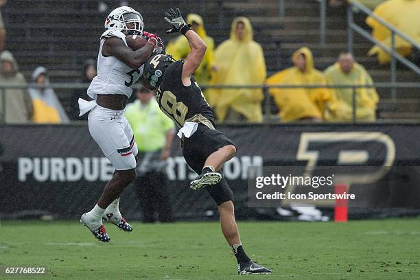 Cincinnati Bearcats safety Mike Tyson intercepts a pass during the NCAA football game between the Purdue Boilermakers and Cincinnati Bearcats at...