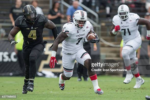 Cincinnati Bearcats running back Tion Green runs for a first down during the NCAA football game between the Purdue Boilermakers and Cincinnati...