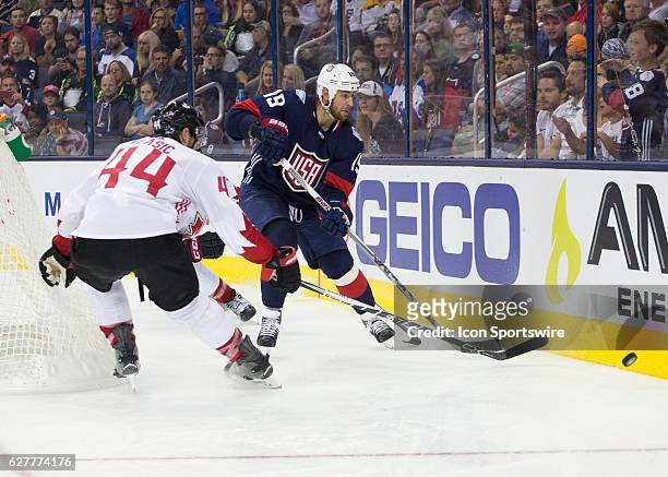 Brandon Dubinsky of Team USA and Marc-Edouard Vlasic of Team Canada during the World Cup of Hockey friendly between Team USA and Team Canada held at...