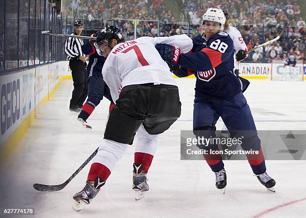 Jake Muzzin of Team Canada and Patrick Kane of Team USA during the World Cup of Hockey friendly between Team USA and Team Canada held at Nationwide...