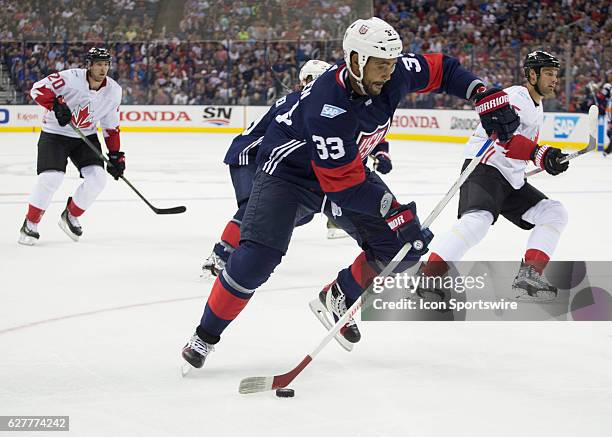 Dustin Byfuglien of Team USA controls the puck during the World Cup of Hockey friendly between Team USA and Team Canada held at Nationwide Arena.