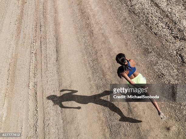 Asian Women With Prosthetic Leg Running In The Desert