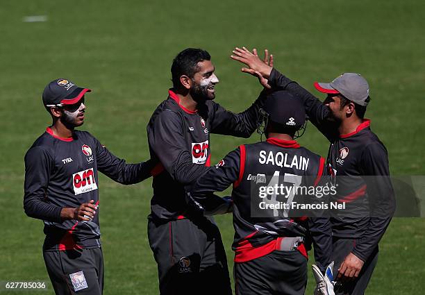 Ahmed Raza of UAE celebrate with teammates after dismissing Ben Foakes of England Lions during the third match between United Arab Emirates and...