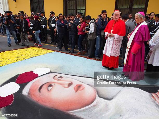 Cardinal Juan Luis Cipriani and Mgr Adriano Tomasi walking on a flowers carpet with the face of Saint Rose of Lima, the patroness of Peru, America,...