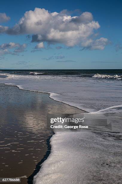 Passing storm provides a blue sky and a sandy beach perfect walking on November 26 in Gaviota State Park, California. Because of its close proximity...