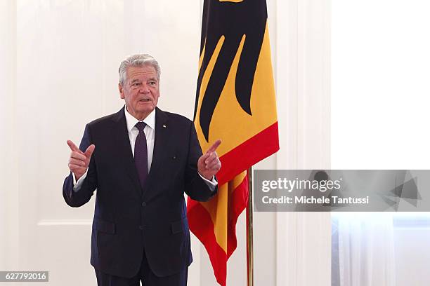 German State President Joachim Gauck gestures as he speaks during the Federal Cross of Merit award ceremony in Bellevue Castle on December 5, 2016 in...