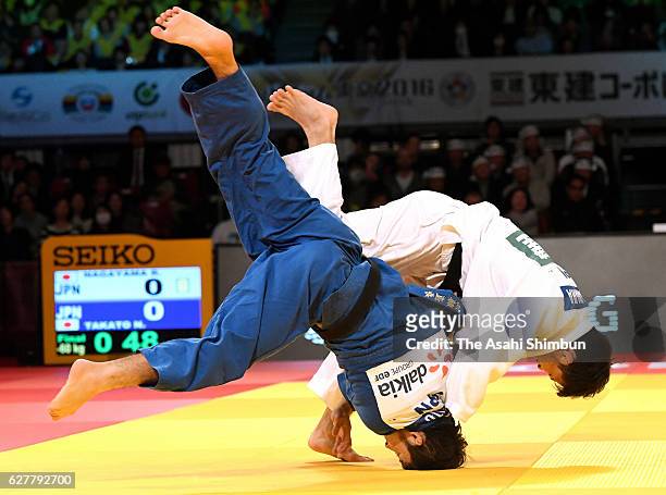 Ryuju Nagayama of Japan throws Naohisa Takato of Japan to win by the Ippon in the Men's -60kg final during day one of the Judo Grand Slam at Tokyo...