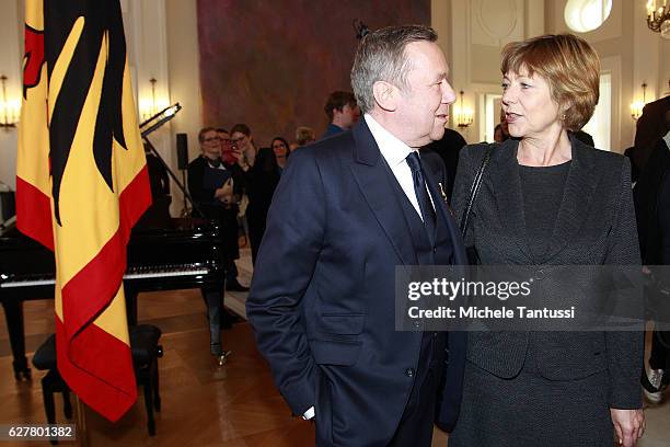 German singer Roland Kaiser chat with President's partner Daniela Schadt during the Federal Cross of Merit award ceremony in Bellevue Castle on...