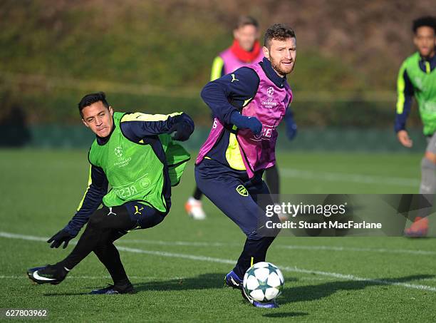 Alexis Sanchez and Shkodran Mustafi of Arsenal during a training session at London Colney on December 5, 2016 in St Albans, England.