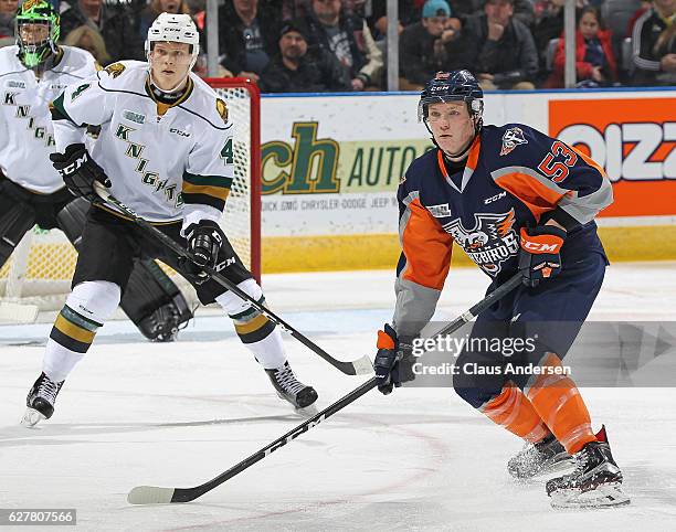 Ty Dellandrea of the Flint Firebirds skates against Olli Juolevi of the London Knights during an OHL game at Budweiser Gardens on December 4, 2016 in...