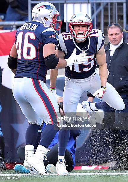 New England Patriots' Chris Hogan celebrates his 14-yard touchdown reception with teammate James Develin during the second quarter. The New England...