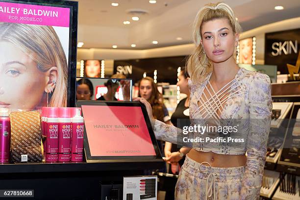 Model Hailey Baldwin poses for photographs following the launch of her signature cosmetics collection with brand ModelCo and beauty retailer Mecca...