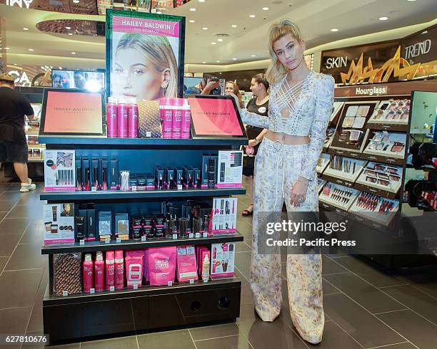 Model Hailey Baldwin poses for photographs following the launch of her signature cosmetics collection with brand ModelCo and beauty retailer Mecca...