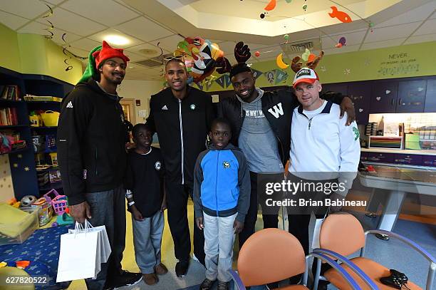 James Young, Al Horford, and Jaylen Brown of the Boston Celtics spread holiday cheer duing a children's hospital visit on December 1, 2016 at Boston...