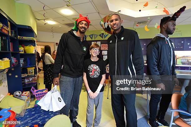 James Young and Al Horford of the Boston Celtics spread holiday cheer duing a children's hospital visit on December 1, 2016 at Boston Children's...