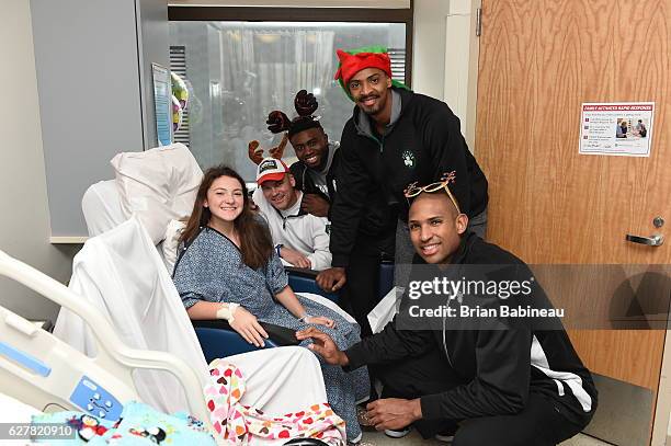 James Young, Al Horford, and Jaylen Brown of the Boston Celtics spread holiday cheer duing a children's hospital visit on December 1, 2016 at Boston...