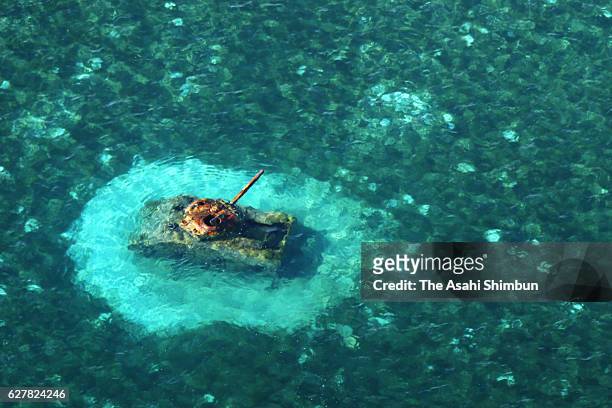 In this aerial image, debris of the United States M4 Sherman tank remains at shallow water off Chalan Kanoa beach on August 27, 2016 in Saipan,...