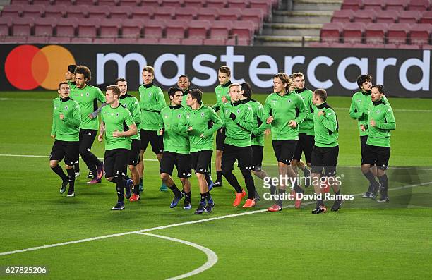 Players warm up during a VfL Borussia Moenchengladbach training session on the eve of their UEFA Champions League match against FC Barcelona at Camp...