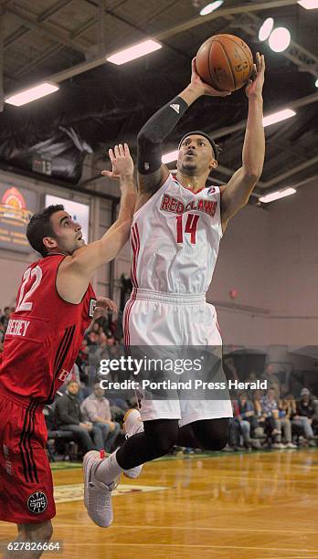 Maine Red Claws vs. The Raptors 905 D-league basketball game. Maine's, Damion Lee, shoots a runner over Raptor Will Sheehey.