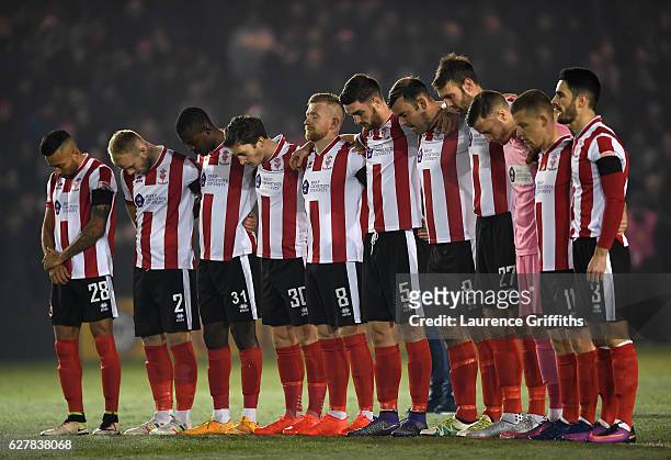 Lincoln City players observe a minutes silence for the victims of the plane crash involving the Brazilian club Chapecoense prior during the Emirates...
