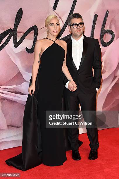 Singer Lady Gaga and desginer Brandon Maxwell attend The Fashion Awards 2016 on December 5, 2016 in London, United Kingdom.