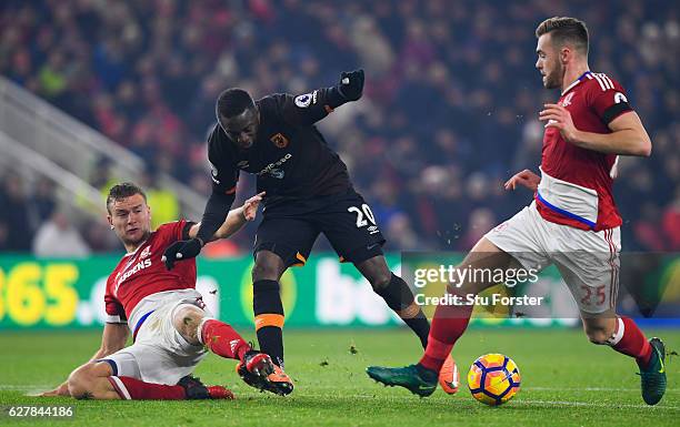 Adama Diomande of Hull City battles with George Friend and Calum Chambers of Middlesbrough during the Premier League match between Middlesbrough and...