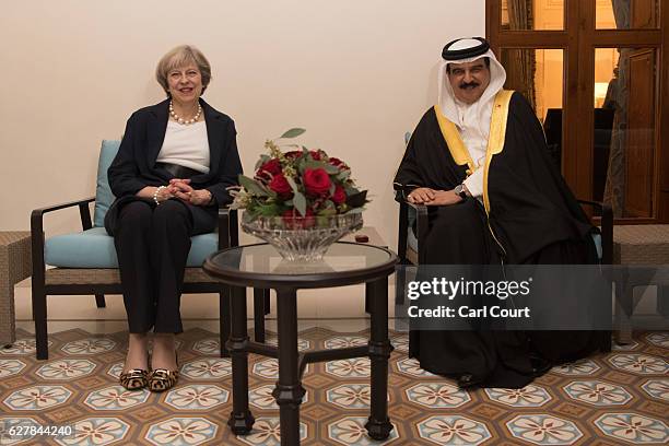 British Prime Minister Theresa May is greeted by the King of Bahrain, Hamad bin Isa Al Khalifa, at the royal family villa after her arrival in...