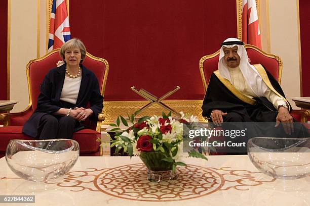 Khalifa bin Salman Al Khalifa, the Prime Minister of Bahrain, greets British Prime Minister Theresa May as she arrives at Sakhir Airbase on December...