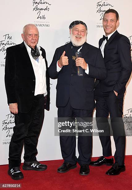 Photographer Bruce Weber poses in the winners room with presenters David Bailey and James Jagger after winning the Isabella Blow award for fashion...