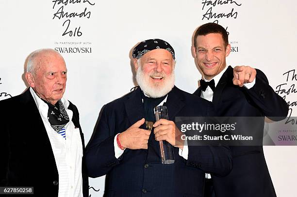 Photographer Bruce Weber poses in the winners room with presenters David Bailey and James Jagger after winning the Isabella Blow award for fashion...