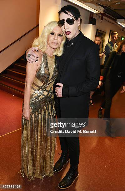 Donatella Versace and Marilyn Manson pose backstage at The Fashion Awards 2016 at Royal Albert Hall on December 5, 2016 in London, United Kingdom.