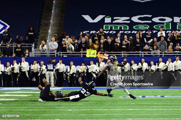 Western Michigan Broncos Wide Receiver Corey Davis runs by the Ohio Bobcats secondary during the MAC Championship game on December 2 at Ford Field in...