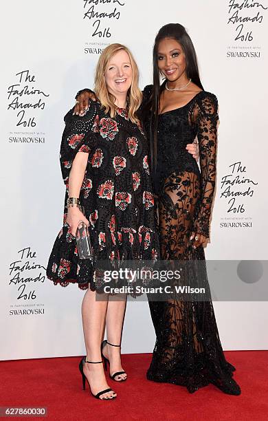 Alexander McQueen designer Sarah Burton poses in the winners room with model Naomi Campbell after winning the British Brand Award at The Fashion...